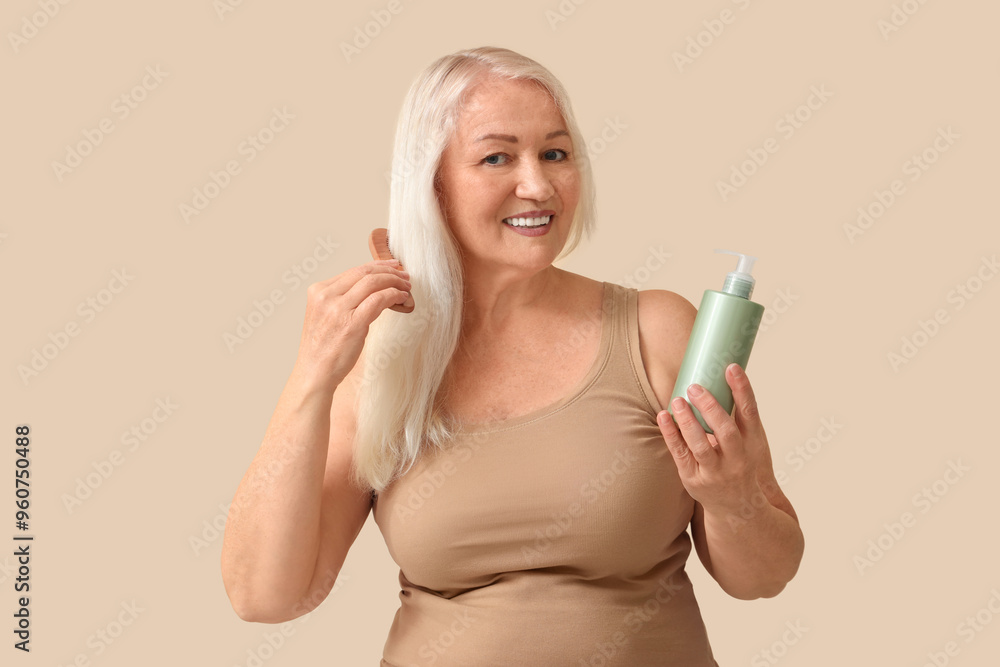 Poster mature blonde woman with bottle of hair product on beige background