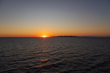 Greek sunsets over the Aegean sea during summer 