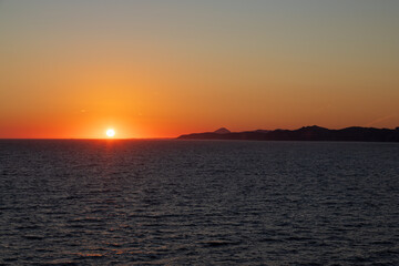 Greek sunsets over the Aegean sea during summer 