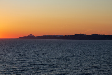 Greek sunsets over the Aegean sea during summer 