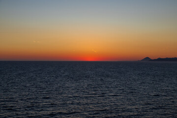 Greek sunsets over the Aegean sea during summer 