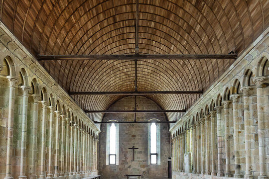 Benedictine Abbey of Mont Saint-Michel is a remarkable example of medieval architecture. Interior of Abbey church refectory - dining hall of monks. Le Mont Sent Michael, France. August, 31, 2024.