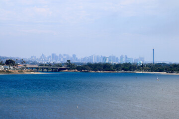 Cityscape of city of San Diego as seen from north side of Mission Bay, California in Summer