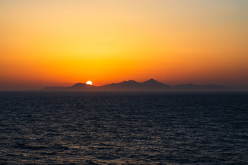 Greek sunsets over the Aegean sea during summer 