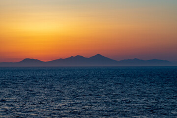 Greek sunsets over the Aegean sea during summer 
