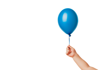 Child's hand holding a blue balloon, isolated on a black background. International Children's Day concept.