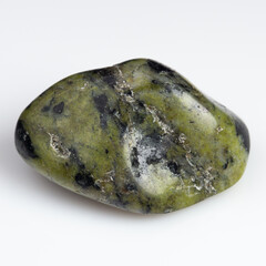 Mesmerizing Green Serpentine Stone with Natural Patterns on White Background