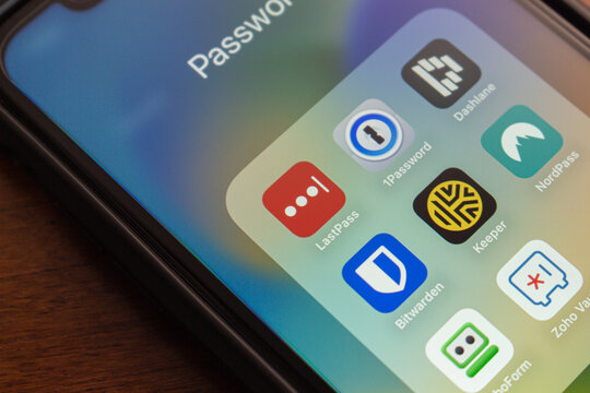 Vancouver, CANADA - Sep 3 2024 : LastPass, 1Password, Dashlane, Bitwarden, Keeper Security, NordPass, RoboForm, and Zoho Vault app icons are displayed on an iPhone. Password management tools concept