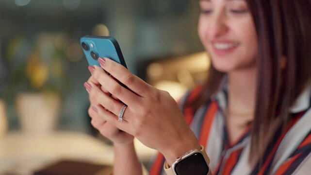 Phone, hands typing and business woman laugh at text message, email or meme at startup. Mobile, closeup and happy employee on chat app for funny joke or comedy with scriptwriter at night on deadline