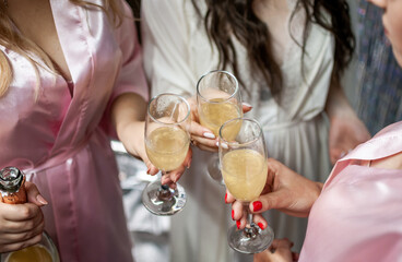 Elegant Celebration Toast with Champagne and Silk Robes