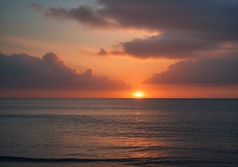 Fototapeta premium Sunset Over Calm Ocean Waves
