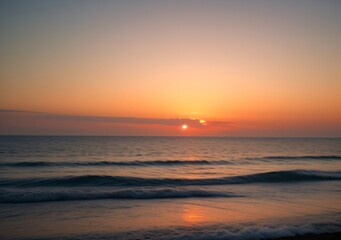 Fototapeta premium Sunset Over Calm Ocean Waves