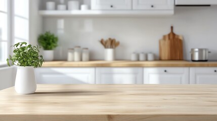Fototapeta premium Bright modern kitchen with wooden countertops, a vase with green plant, and minimalistic white cabinets and utensils.