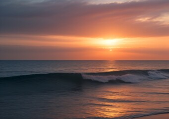 Fototapeta premium Sunset Over Calm Ocean Waves