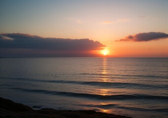 Fototapeta premium Sunset Over Calm Ocean Waves