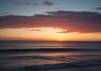 Fototapeta premium Sunset Over Calm Ocean Waves