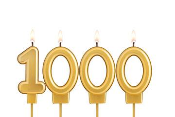 Golden number 1000 birthday candle on white background