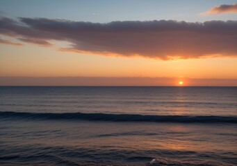 Fototapeta premium Sunset Over Calm Ocean Waves