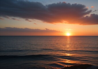 Obraz premium Sunset Over Calm Ocean Waves
