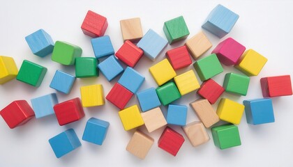 Obraz premium Colorful Wooden Blocks Arranged in a Random Pattern on a White Surface