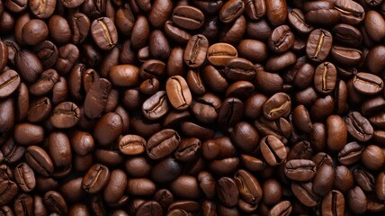 Fototapeta premium A close-up view of roasted coffee beans, showcasing their rich color and texture, ideal for coffee enthusiasts.