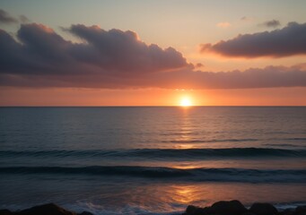 Fototapeta premium Sunset Over Calm Ocean Waves