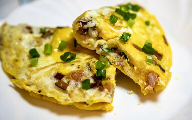 Traditional omelette with bacon and chives, real food, strong and nutritious protein