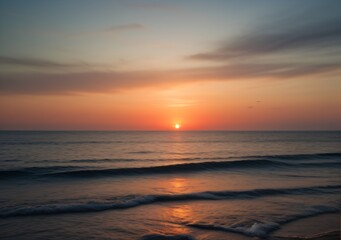 Fototapeta premium Sunset Over Calm Ocean Waves