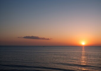 Sunset Over Calm Ocean Waves