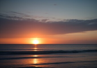 Obraz premium Sunset Over Calm Ocean Waves