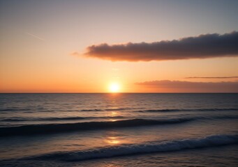 Fototapeta premium Sunset Over Calm Ocean Waves