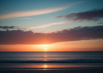 Fototapeta premium Sunset Over Calm Ocean Waves