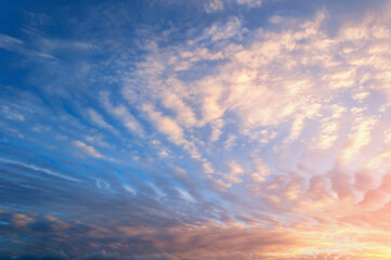 Fototapeta premium Sunset sky clouds with real sun beams, natural sunset sky background, colorful sunset sky landscape