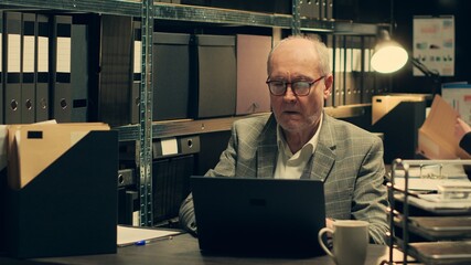 Senior inspector identifying patterns in criminal behavior by analyzing classified files and legal...