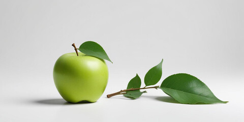 A green apple with a leaf, on a white background