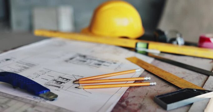 Architecture, equipment and blueprint with ruler or helmet for floor plan, renovation sketch and building design. Paperwork, drawing and scale for construction site, development and project process