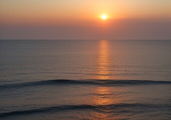 Fototapeta premium Sunset Over Calm Ocean Waves