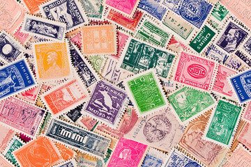 Seamless pattern of vintage postage stamps from around the world, slightly overlapping