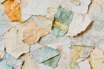 Naklejka premium Seamless pattern of vintage map fragments showing different parts of the world, slightly overlapping