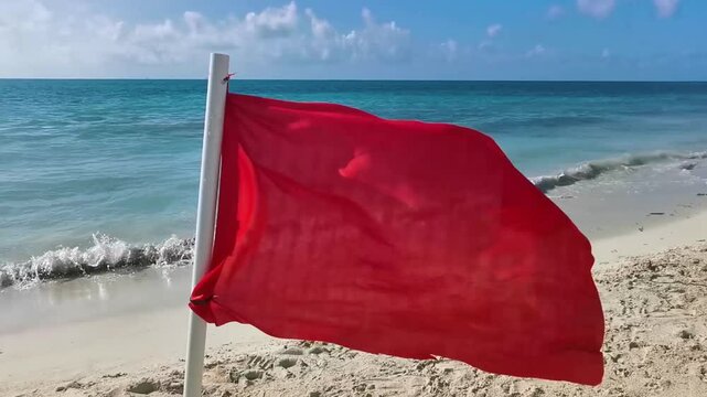 Red flag swimming prohibited high waves Playa del Carmen Mexico.
