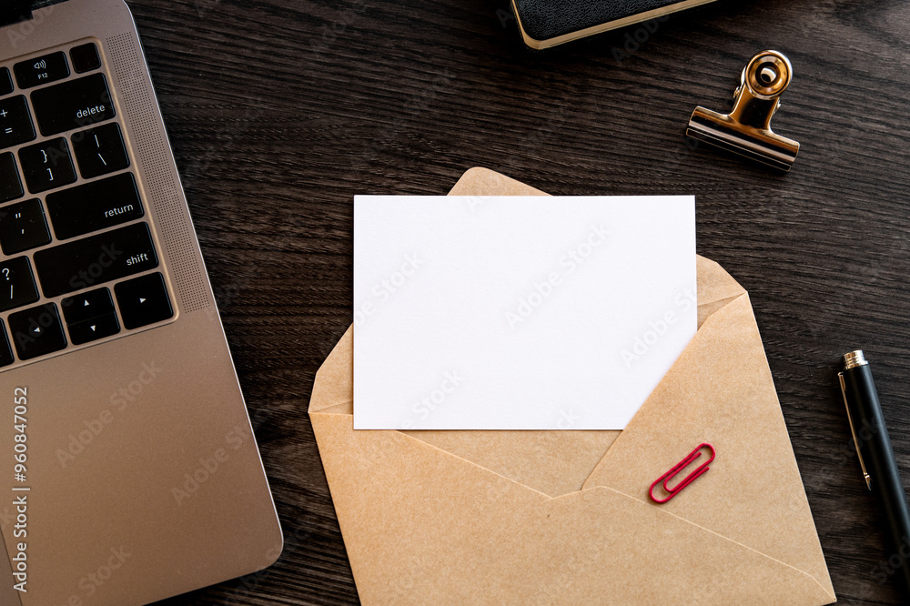 Poster a white card removed from an envelope on the desk. as material for composing letters.