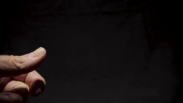 US Quarter Flicked from Man's Thumb