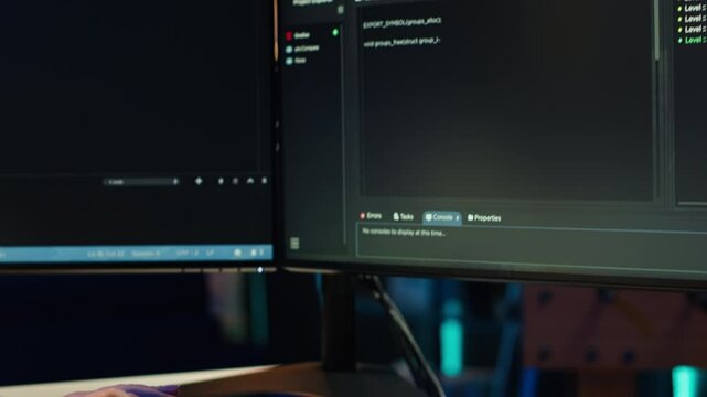 Programmer typing on computer to fix vulnerabilities in software enabling attackers to compromise systems. Woman taking care of security exposures in operating system, writing code, camera A close up
