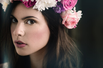 Naklejka premium Flower, crown and portrait of woman with cosmetics, confidence and organic floral mockup space. Roses, eco friendly and serious face of girl with natural beauty, makeup and healthy skincare in nature