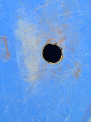 metal hole in the blue color. metal texture.