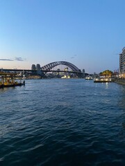 the sydney harbour bridge at sunset