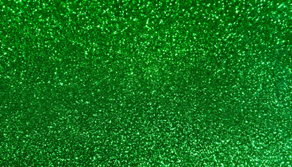 Fototapeta premium green glitter texture, filling the entire frame with a rich, bold, and sparkling surface that offers a striking and vibrant pattern.