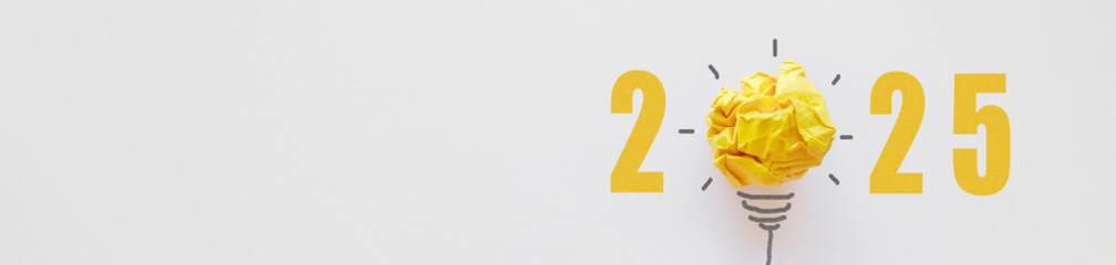 2025 with Yellow paper light bulb, innovative business vision and new year resolution concept