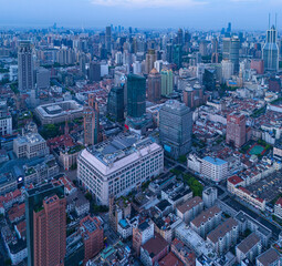 Aerial view of modern city skyline and buildings at sunrise in Shanghai