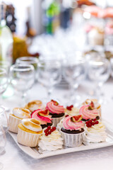 delicious dessert eclairs, Sweet cupcakes, Colorful macaroons, Bakery sweet, banquet table, holiday. Birthday, wedding, strawberry cake, donuts, tart, chocolate cake slice